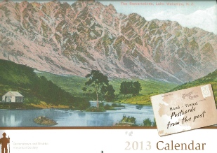The cover of the 2013 calendar, showing a hand-tinted postcard of the Remarkables above Lake Wakatipu