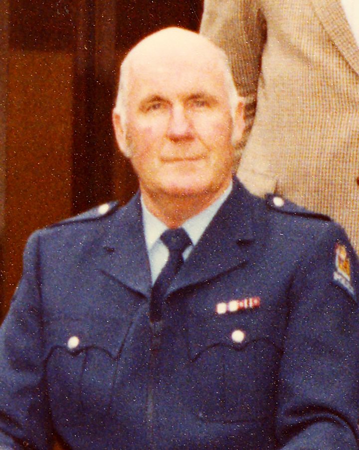 Sergeant Warwick Maloney in police uniform, a colour photograph from the New Zealand Police Museum